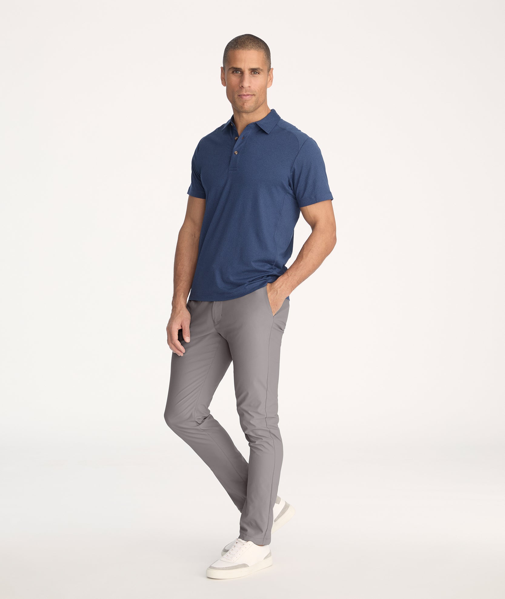 Model wearing Traveler Pant in Mid Grey - full body