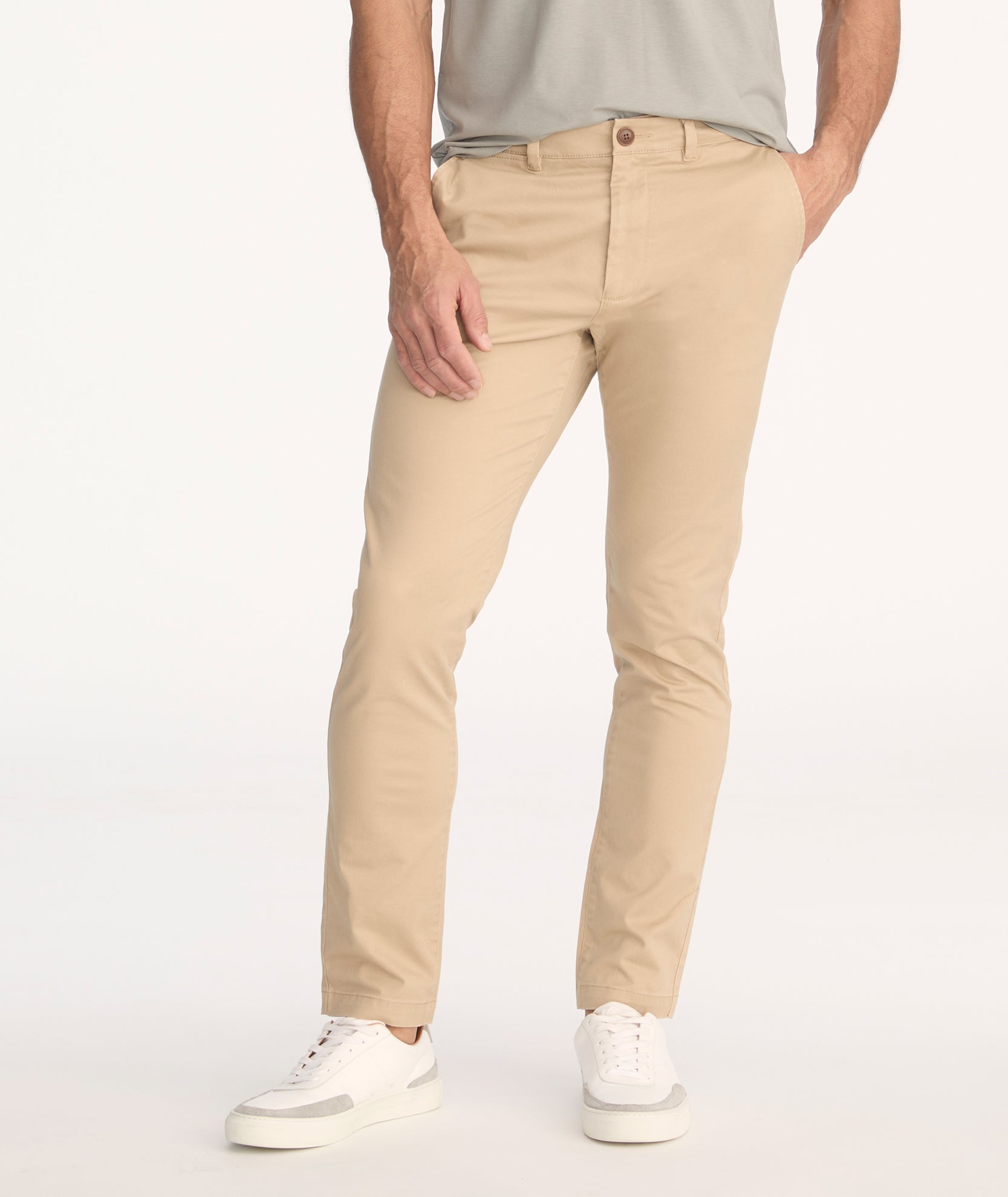 Model is wearing UNTUCKit Classic Chino Pants in Khaki.