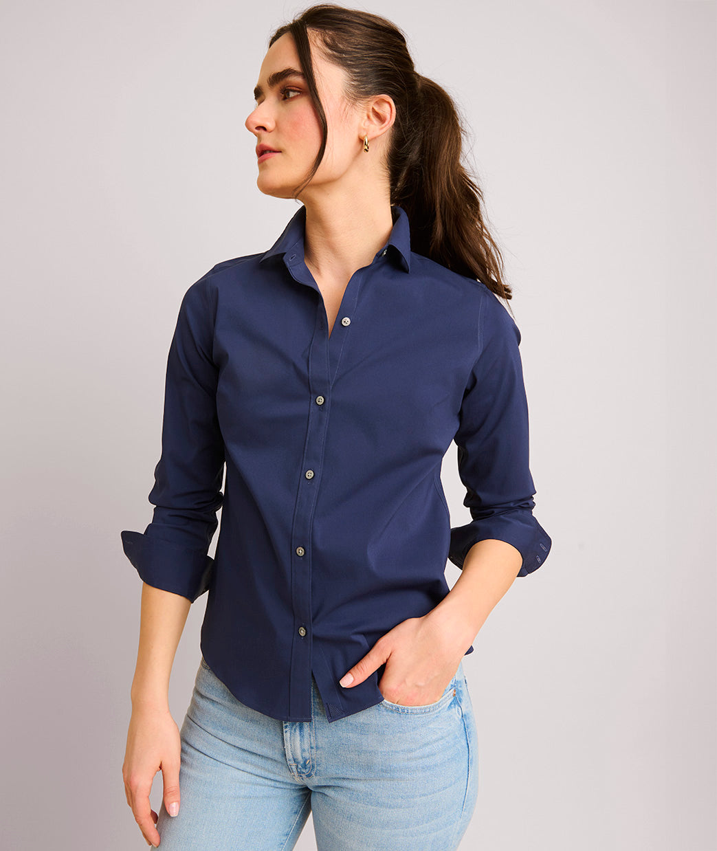 Model is wearing UNTUCKit Bella shirt in blue.