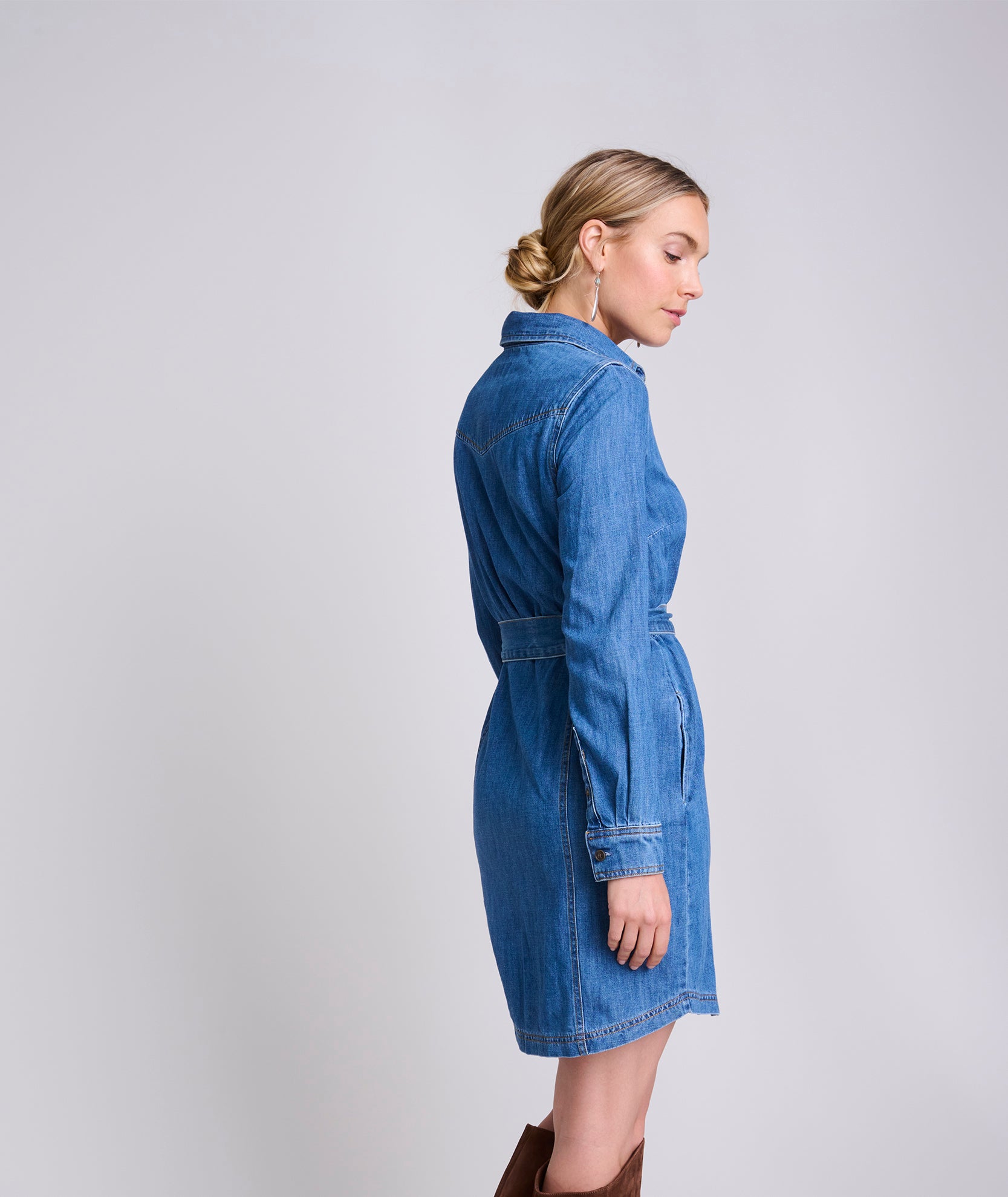 Model is wearing UNTUCKit Lea denim dress.