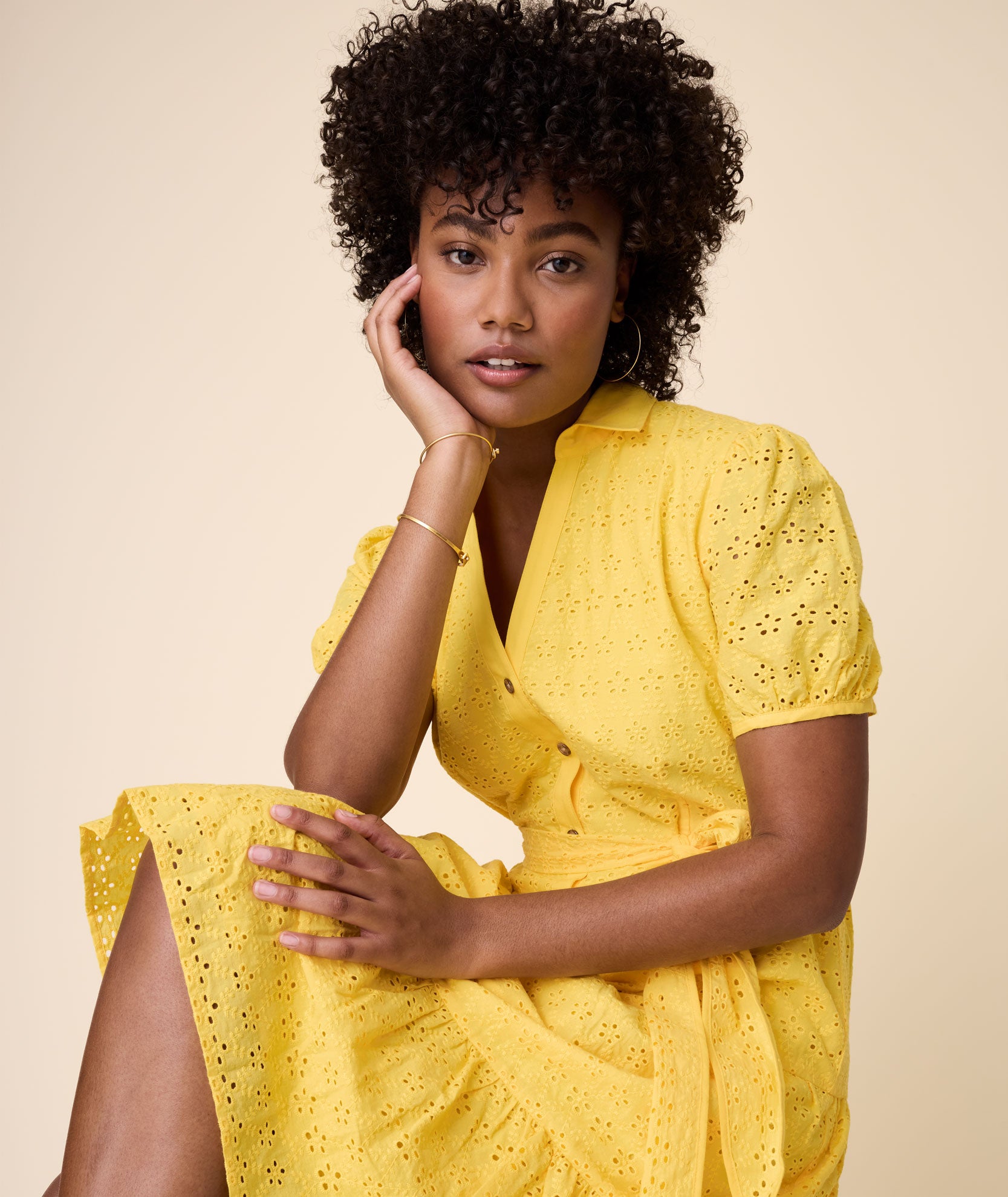 Model is wearing UNTUCKit solid Yellow Augusta Dress.