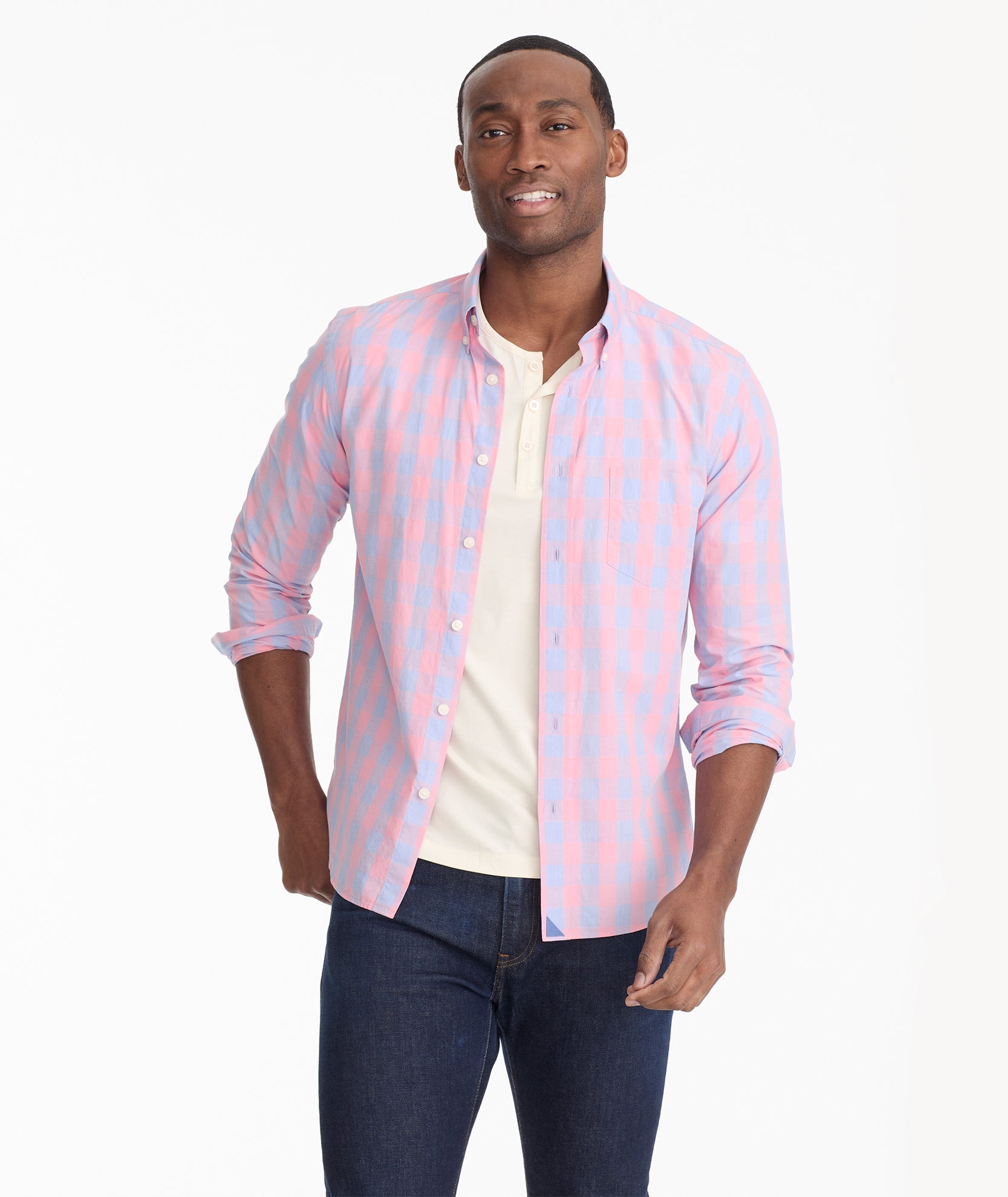 Model is wearing UNTUCKit Bookman vintage wash plaid shirt in pink.