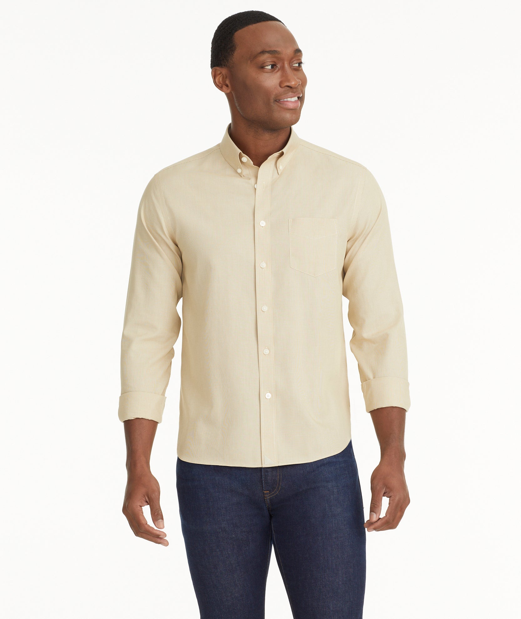 Model is wearing UNTUCKit Wrinkle-Free Cadetto Shirt in Tan.