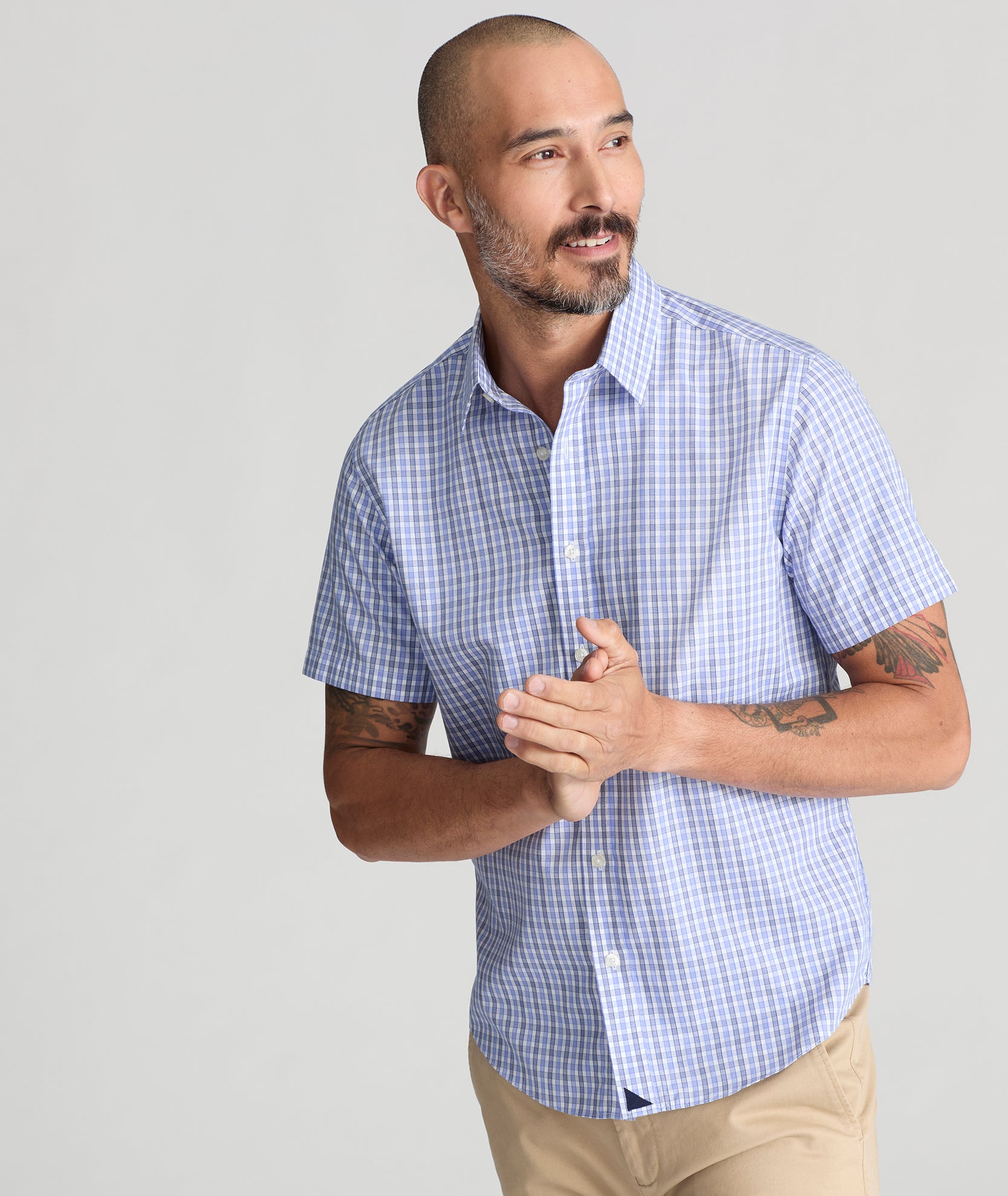 Model is wearing UNTUCKit Dante Short sleeve wrinkle-free shirt.