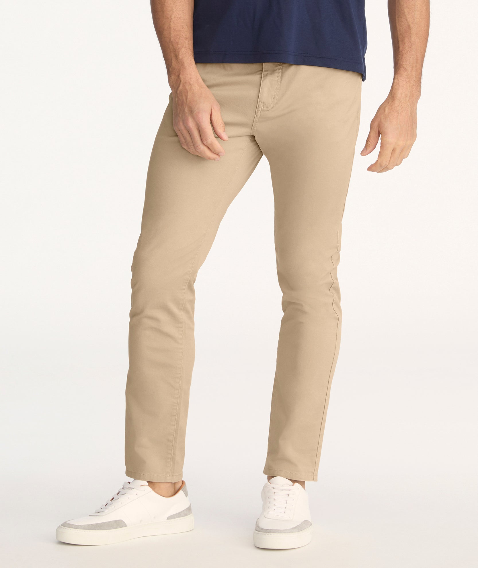 Model is wearing UNTUCKit 5-Pocket Chino Pants in Khaki.