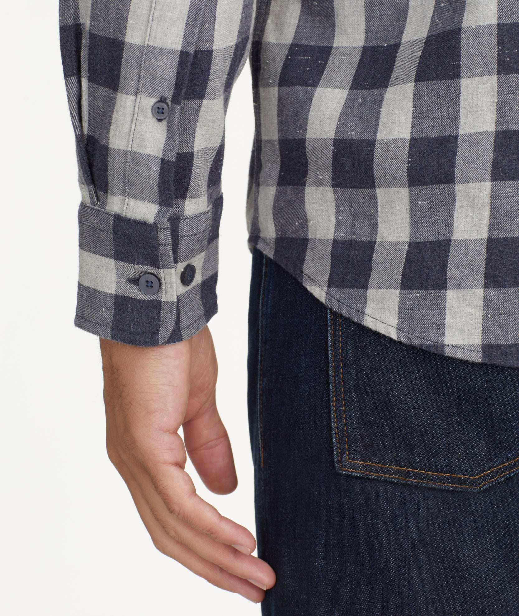 Model is wearing UNTUCKit gray and navy Buffalo check flannel.