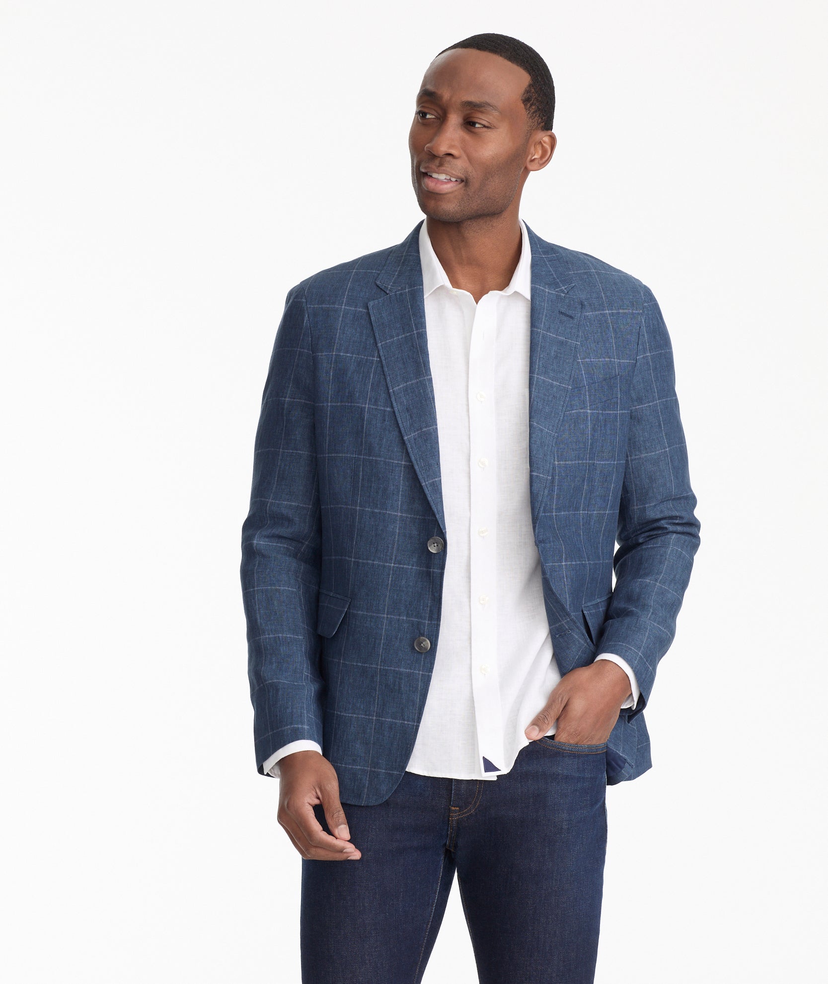 Model is wearing UNTUCKIt Hampton sport coat in navy.