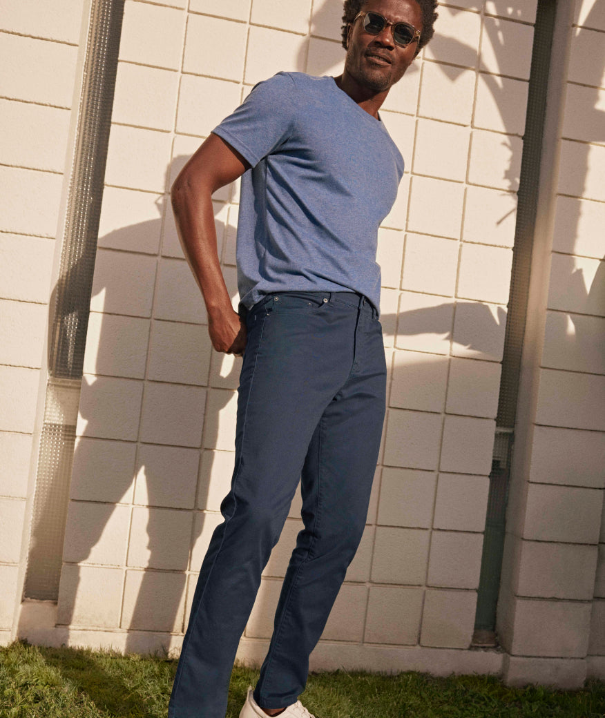 Model is wearing UNTUCKit 5-Pocket Chino Pants in navy.