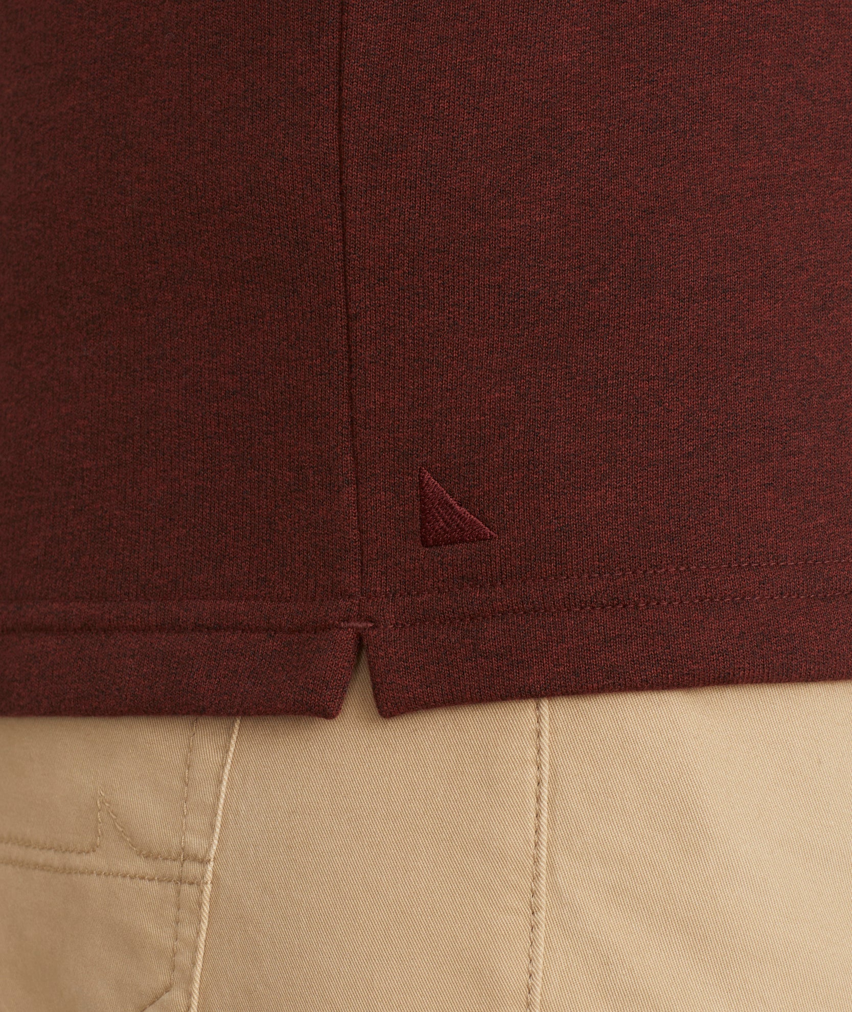 Model is wearing UNTUCKit Snap Fleece Pullover in Brick Red.