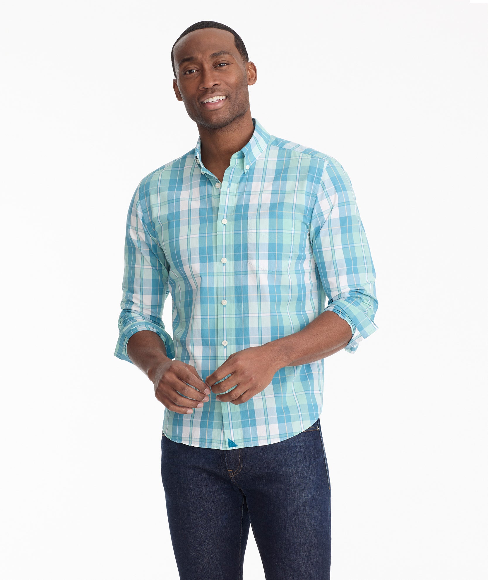 Model is wearing UNTUCKit Porter vintage wash shirt in green plaid.