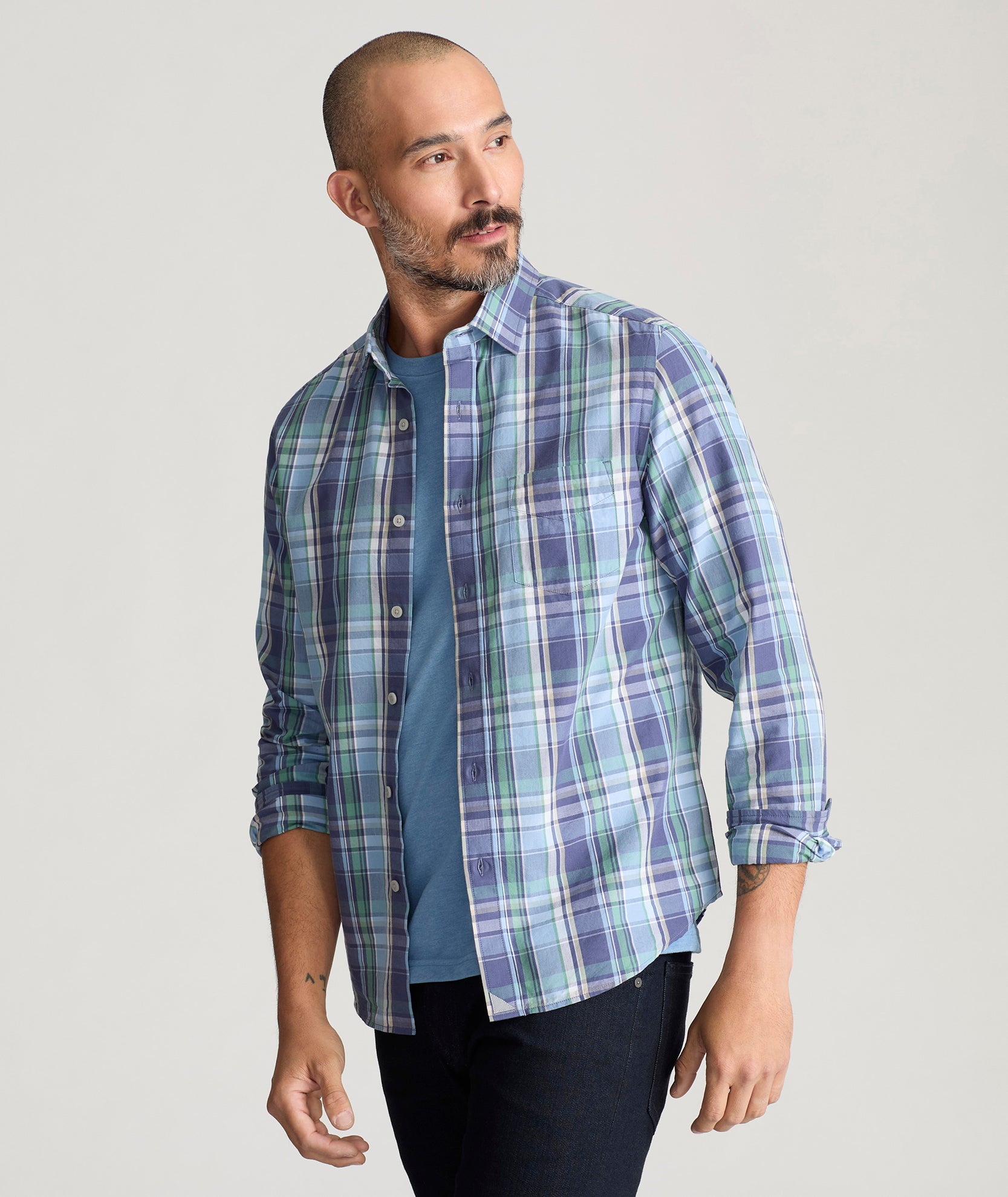 Model is wearing UNTUCKit Rombauer shirt in summer plaid. 