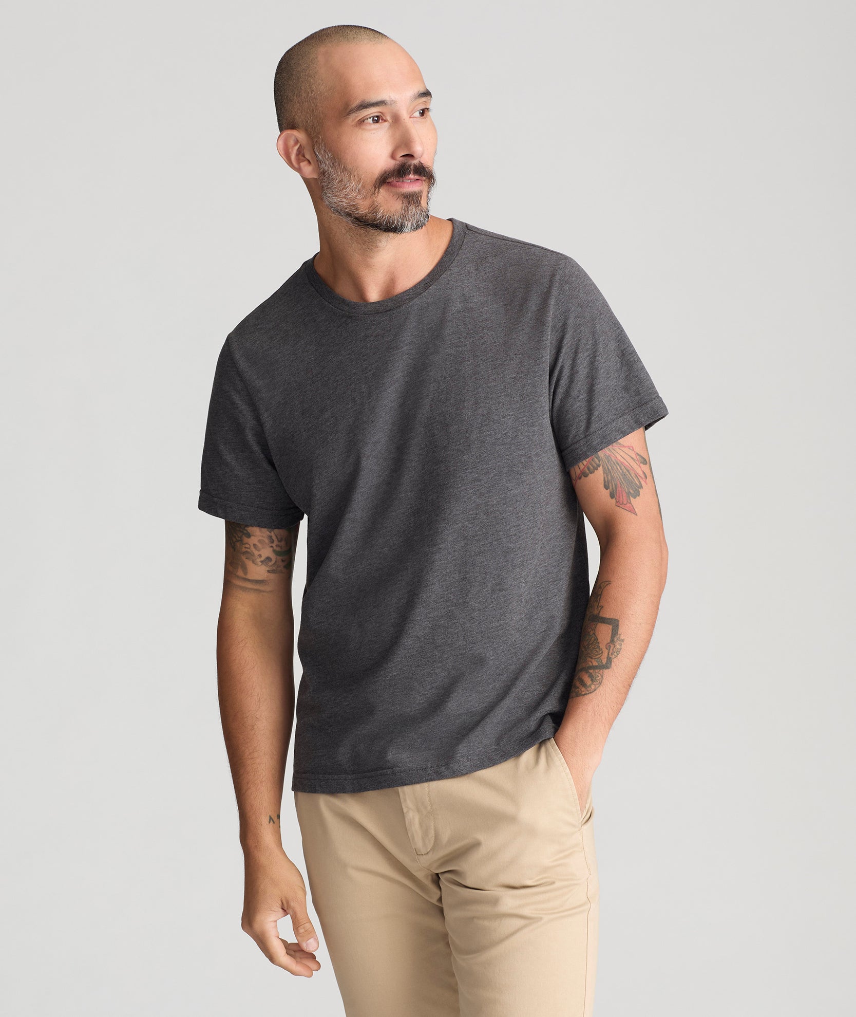 Model is wearing UNTUCkKit saxum ultra soft  tee  in charcoal. 