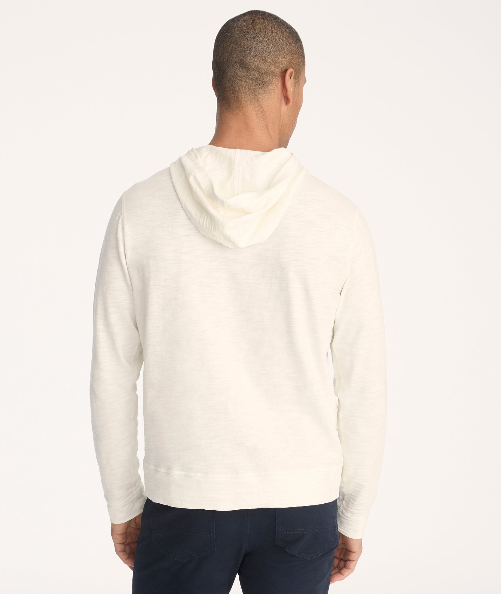 Model is wearing UNTUCKit Slub Cotton Hoodie in Off-White egret.