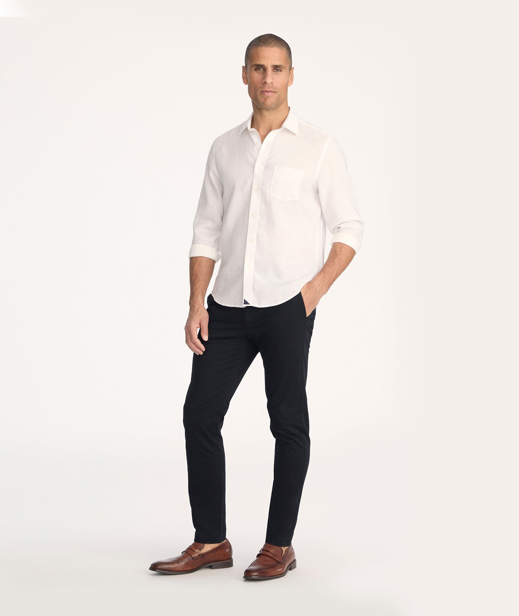 Model is wearing UNTUCKit Classic Chino Pants in black - full body