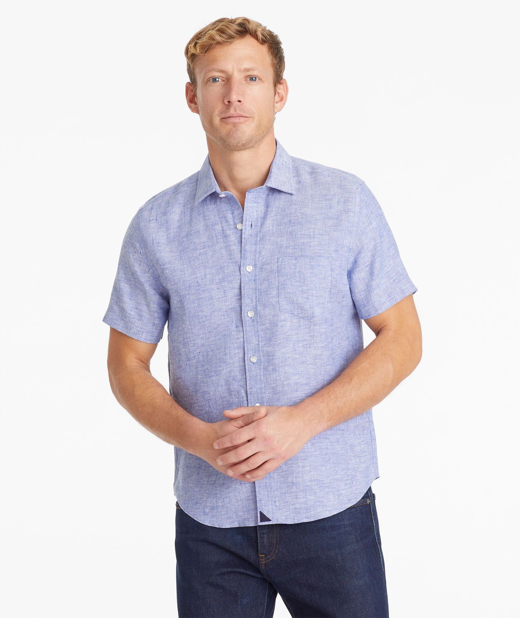 Model wearing an UNTUCKit Blue Wrinkle-Resistant Linen Short Sleeve Cameron Shirt