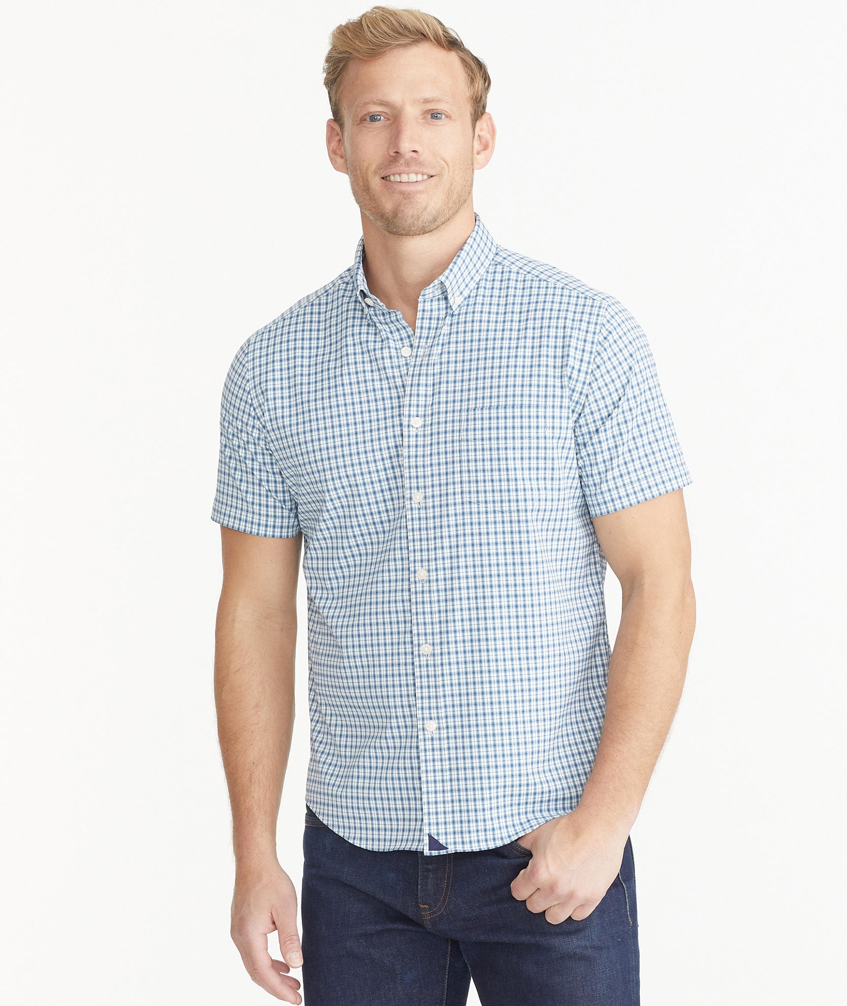 Model is wearing UNTCKit Navy Check Wrinkle-Free Performance Short-Sleeve Matarazzo Shirt