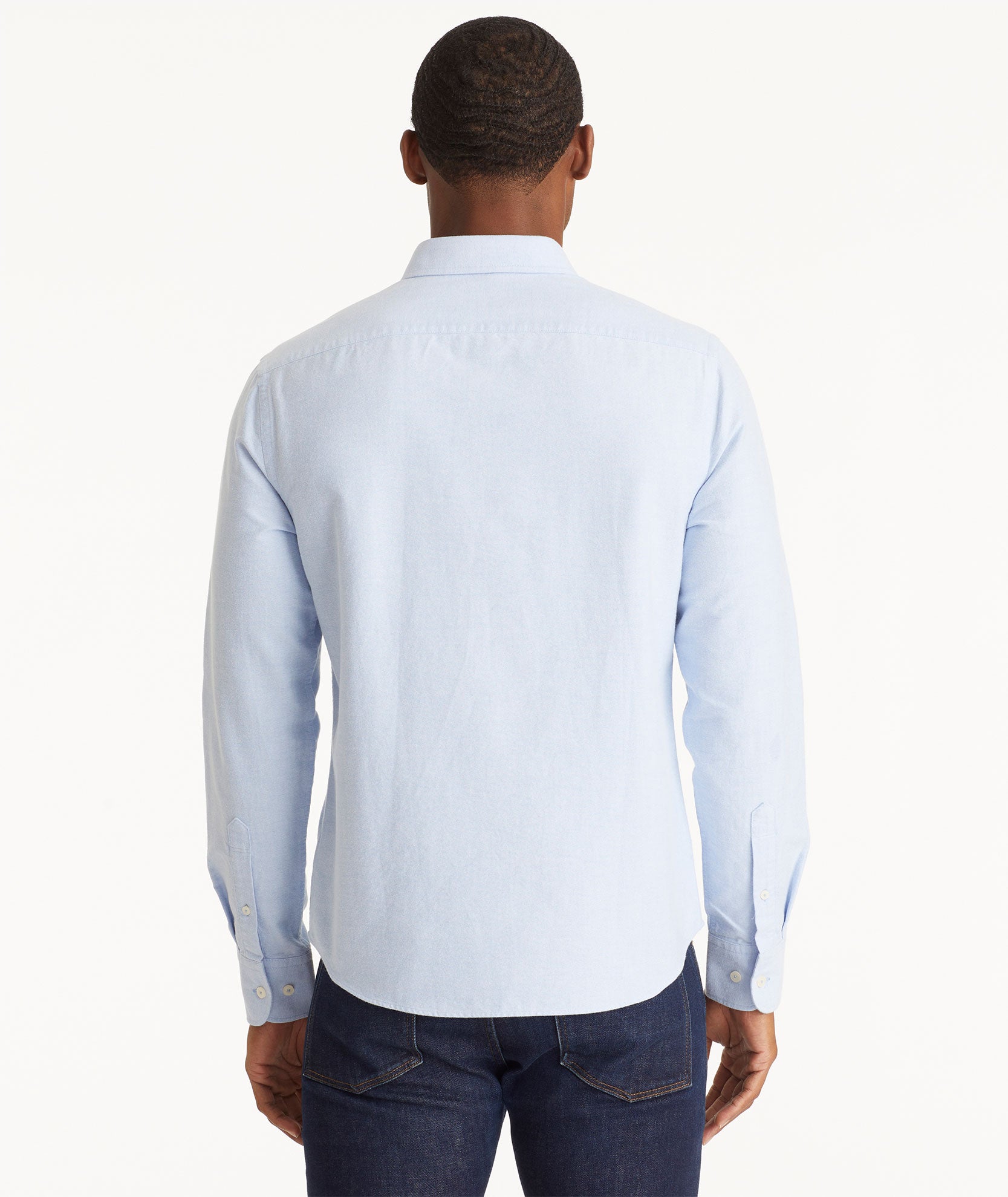 Model wearing an UNTUCKit Light Blue Oxford Picardan Shirt